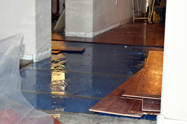 Professional Flood Damage Restoration technician working in Acworth, NH